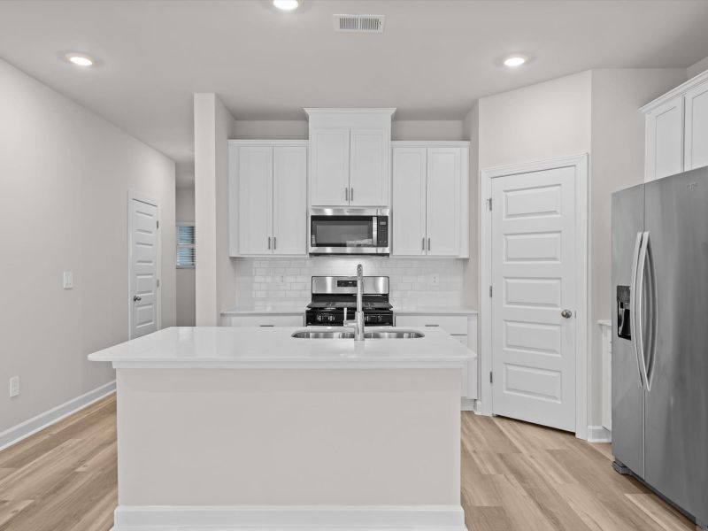 Furnished interior view inside a new home in Crossing at Abner Creek Townes, Greer (Image 4).