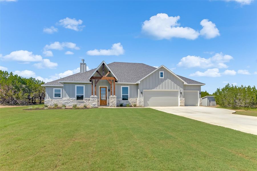 Front exterior of a new home in , Bertram, TX, highlighting curb appeal (Image 21).