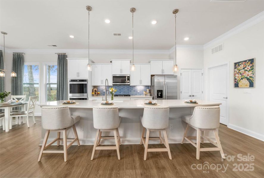 Kitchen island can comfortably seat 4 people and more if needed