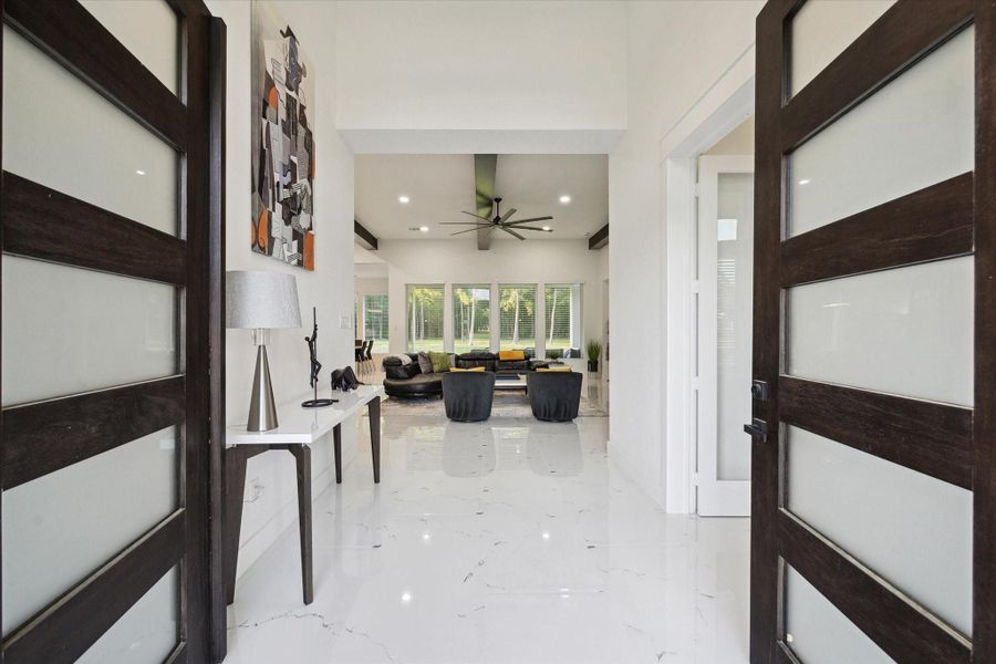 Light and bright Entry through the front double doors Light and bright Entry through the front double doors