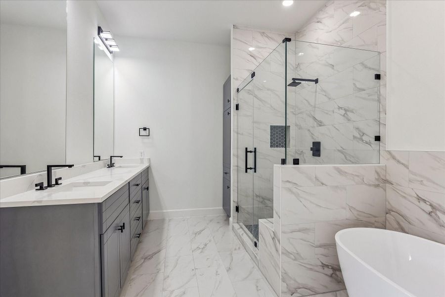 Exquisite primary bathroom showcasing gleaming quartz countertops with dual sinks, combining timeless elegance with practical luxury. Exquisite primary bathroom showcasing gleaming quartz countertops with dual sinks, combining timeless elegance with practical luxury.