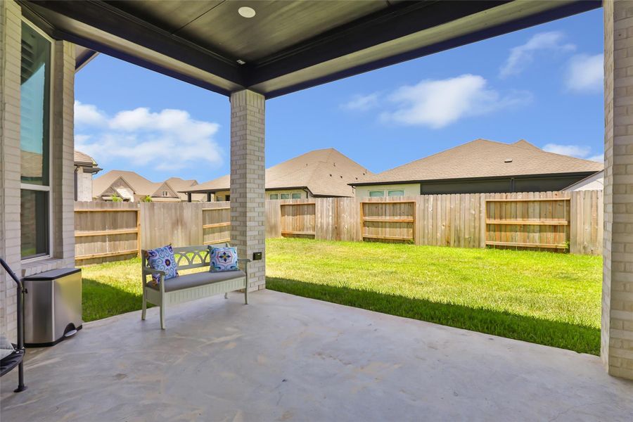 Exterior details and patio area of a home in Grand Central Park, Conroe (Image 27).