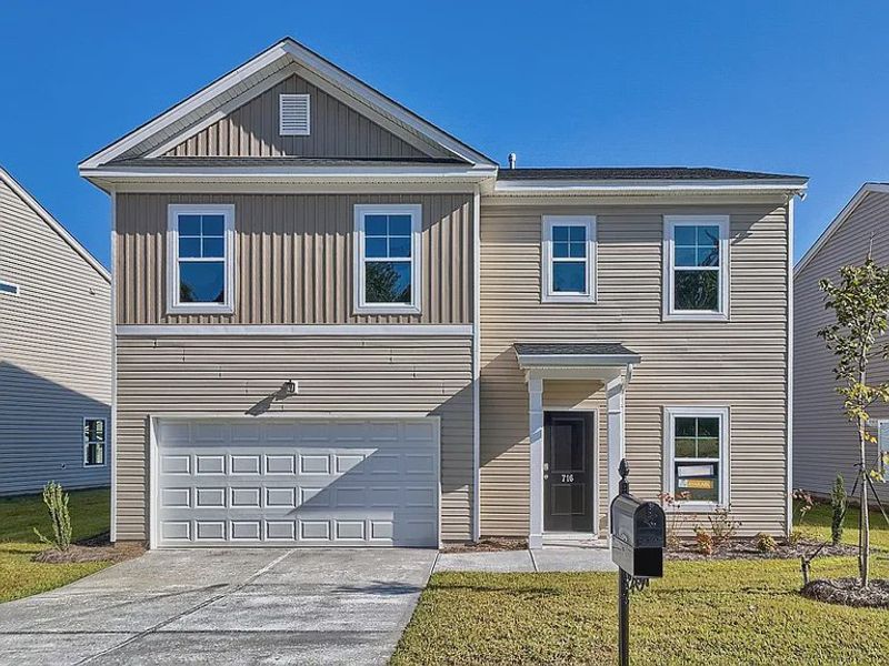 Front exterior of a new home in Emanuel Creek, West Columbia, SC, highlighting curb appeal (Image 1).