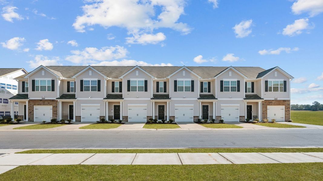 Front exterior of a new home in The Townes at Ridgewood Farms, Winterville, NC, highlighting curb appeal (Image 20).