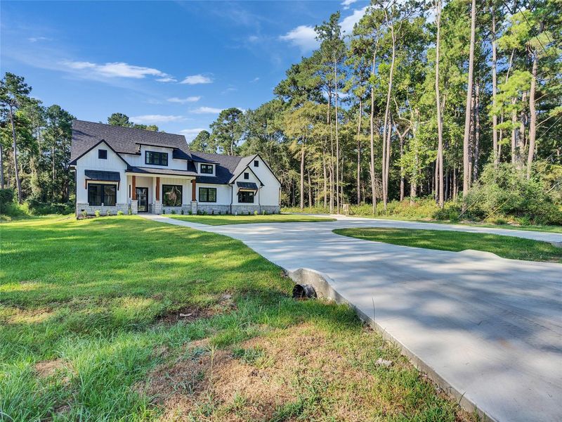 Front exterior of a new home in , Magnolia, TX, highlighting curb appeal (Image 29).
