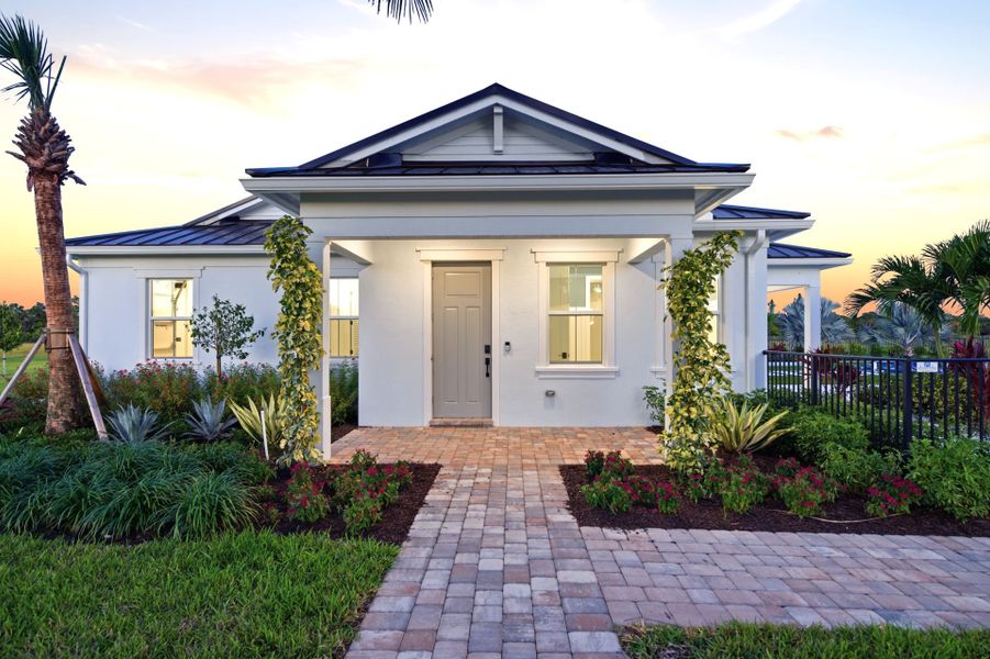 Front exterior of a new home in Bridgewater, Jupiter, FL, highlighting curb appeal (Image 2).