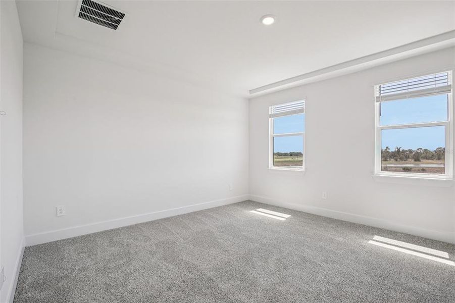 Spacious, unfurnished interior of a new home in Magnolia Bay - Reserve Series, Nokomis (Image 23).