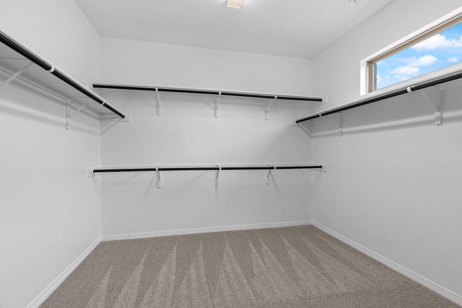 Walk-in closet in Primary Bedroom Walk-in closet in Primary Bedroom