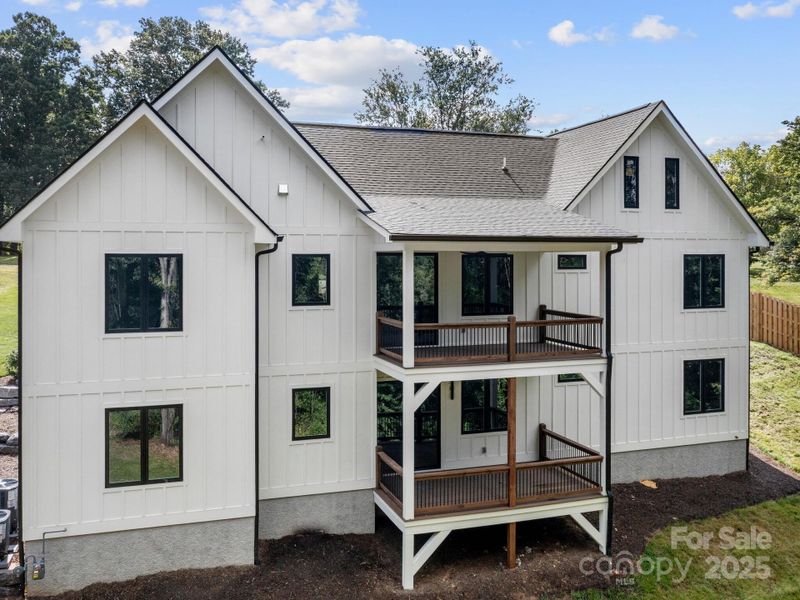 Front exterior of a new home in , Candler, NC, highlighting curb appeal (Image 19).