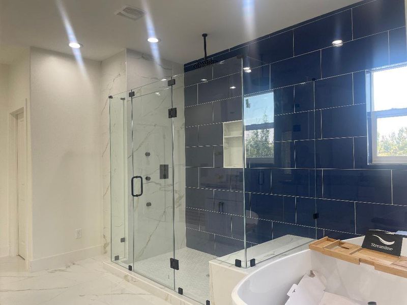 The luxurious primary en-suite  awaits