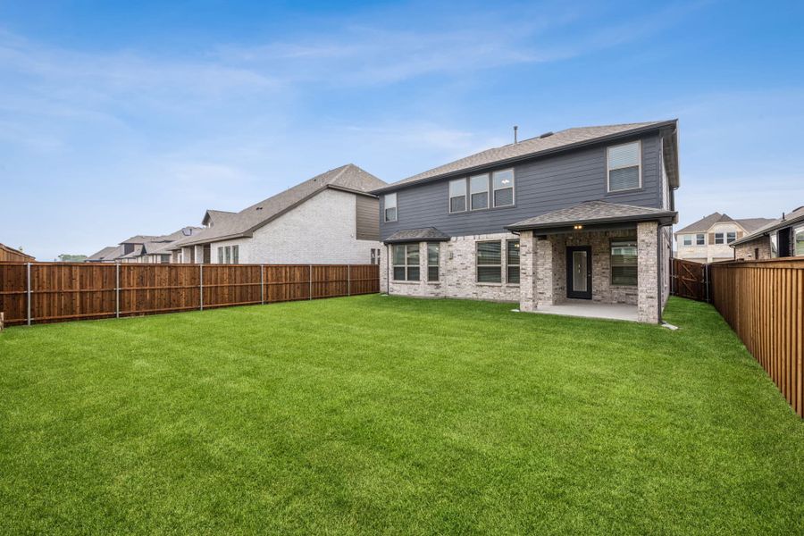 Front exterior of a new home in Las Lomas, Forney, TX, highlighting curb appeal (Image 18). Front exterior of a new home in Las Lomas, Forney, TX, highlighting curb appeal (Image 18).