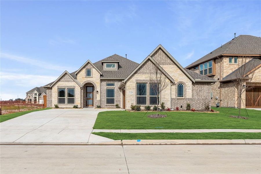 Front exterior of a new home in Stone River Glen 60s, Royse City, TX, highlighting curb appeal (Image 2).