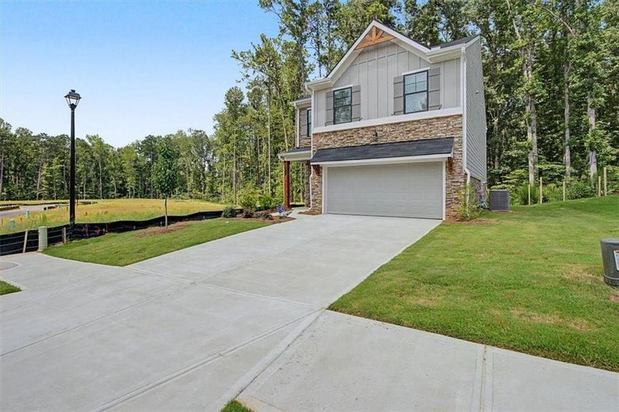 Front exterior of a new home in Sawmill Creek, Mableton, GA, highlighting curb appeal (Image 26).