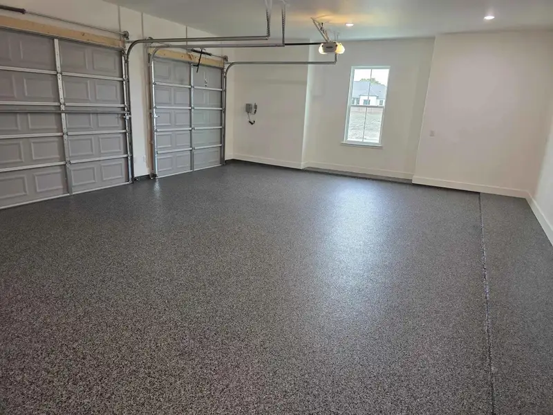 Garage featuring baseboards Garage featuring baseboards