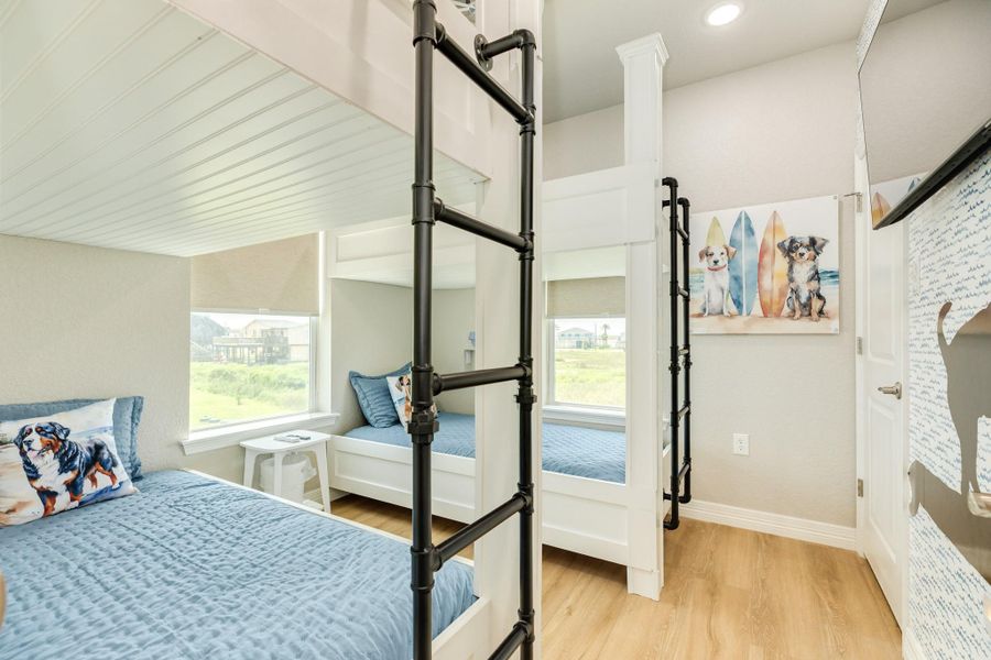 Custom bunk room offers built-in sleeping accommodations, creative design details, and a fun, functional layout ideal for hosting additional guests.