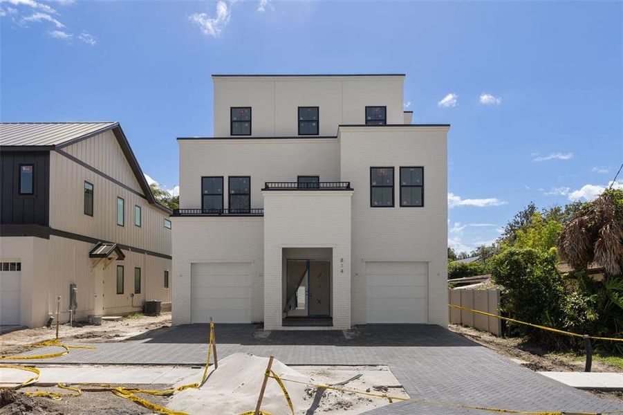Front exterior of a new home in , Tampa, FL, highlighting curb appeal (Image 1). Front exterior of a new home in , Tampa, FL, highlighting curb appeal (Image 1).