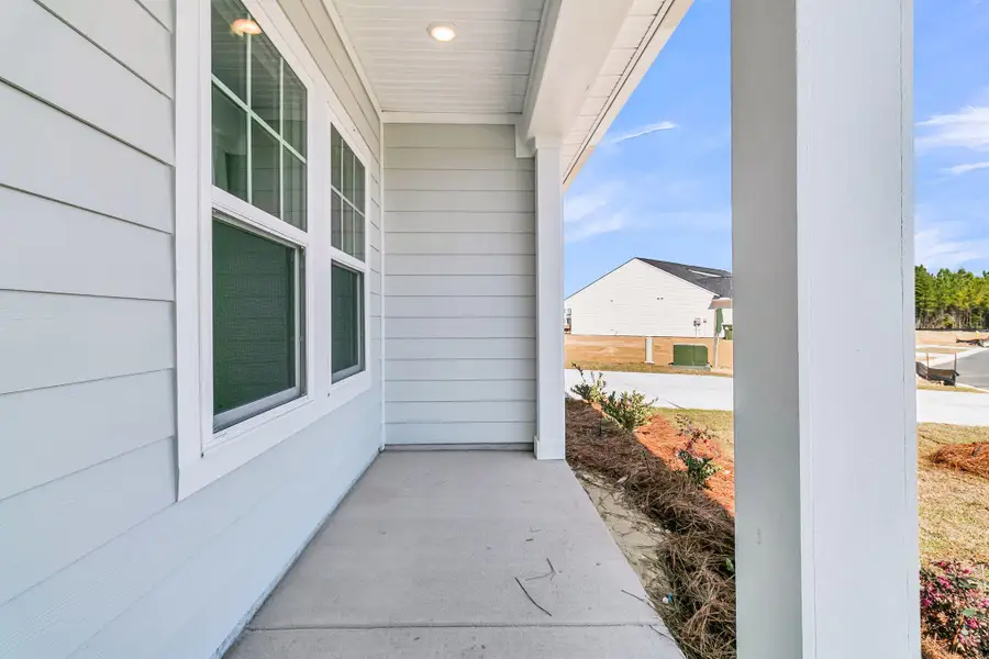 Exterior details and patio area of a home in , Ravenel (Image 19).