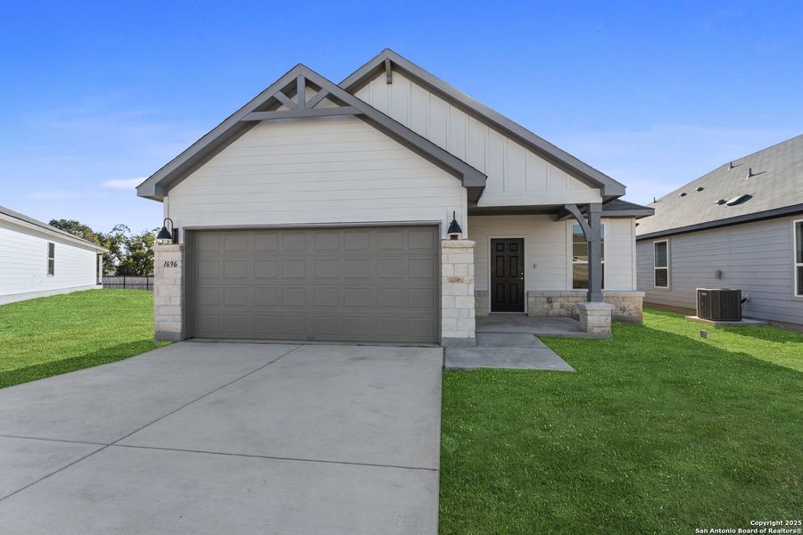 Front exterior of a new home in Meadows at Clear Springs, New Braunfels, TX, highlighting curb appeal (Image 1).