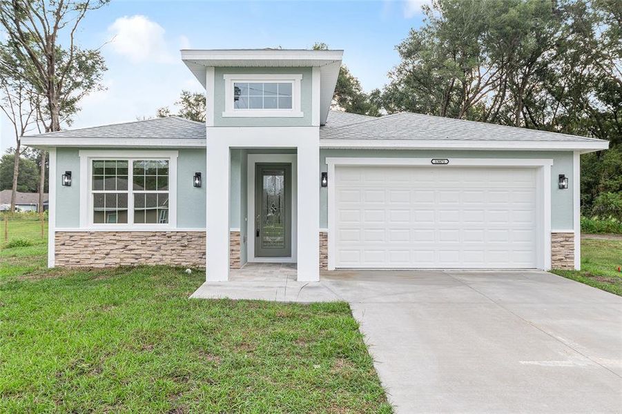 Front exterior of a new home in , Summerfield, FL, highlighting curb appeal (Image 28). Front exterior of a new home in , Summerfield, FL, highlighting curb appeal (Image 28).