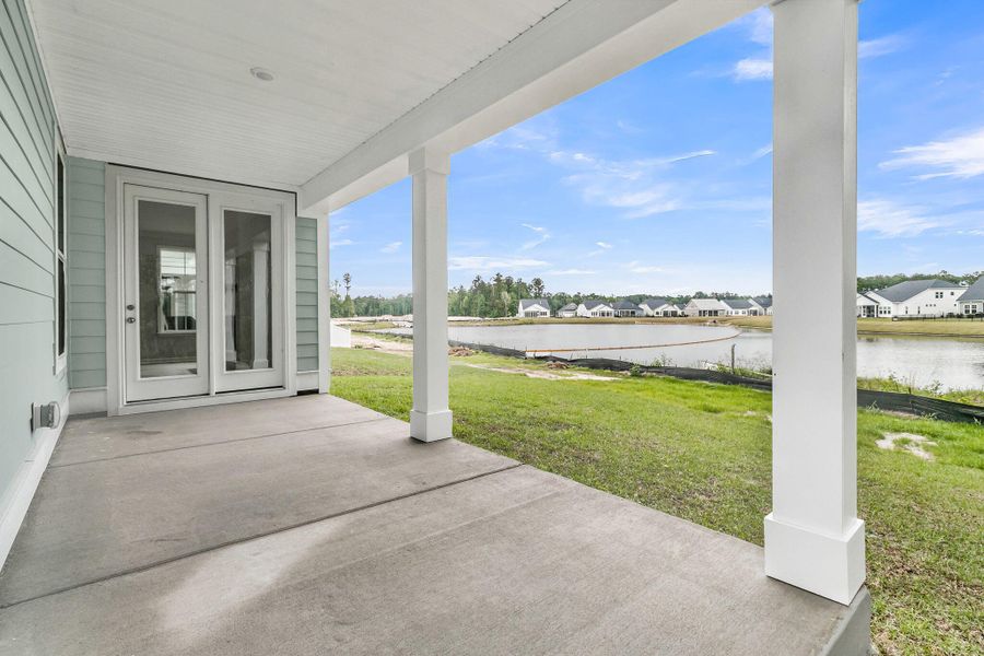 Exterior details and patio area of a home in Tidewater at Lakes of Cane Bay, Summerville (Image 23). Exterior details and patio area of a home in Tidewater at Lakes of Cane Bay, Summerville (Image 23).