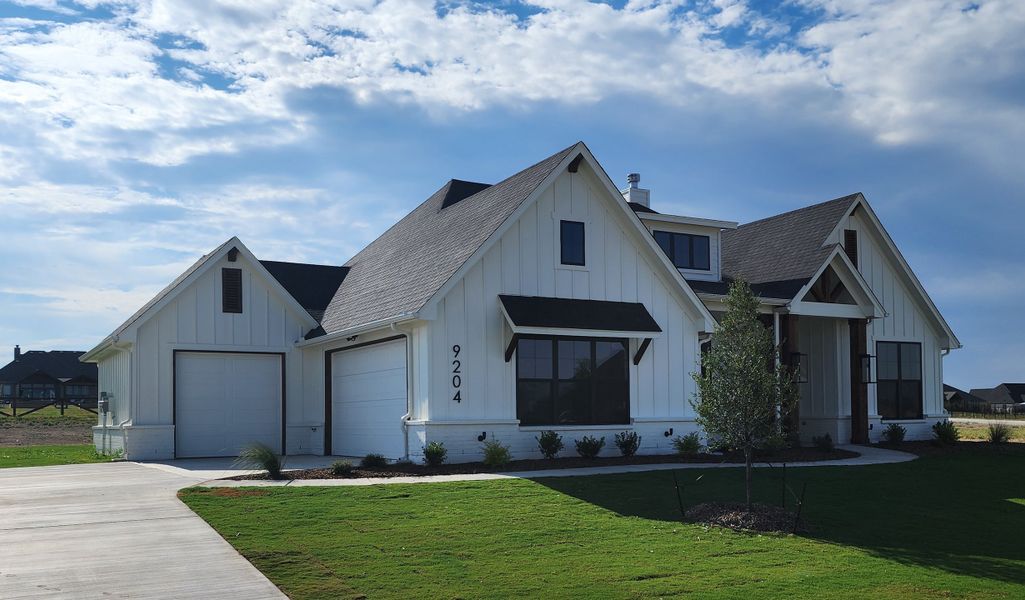 Front exterior of a new home in Paloma Ranches, Justin, TX, highlighting curb appeal (Image 2). Front exterior of a new home in Paloma Ranches, Justin, TX, highlighting curb appeal (Image 2).
