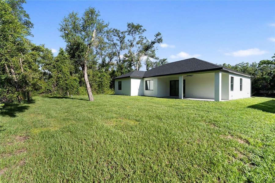 Front exterior of a new home in , Port Charlotte, FL, highlighting curb appeal (Image 28). Front exterior of a new home in , Port Charlotte, FL, highlighting curb appeal (Image 28).