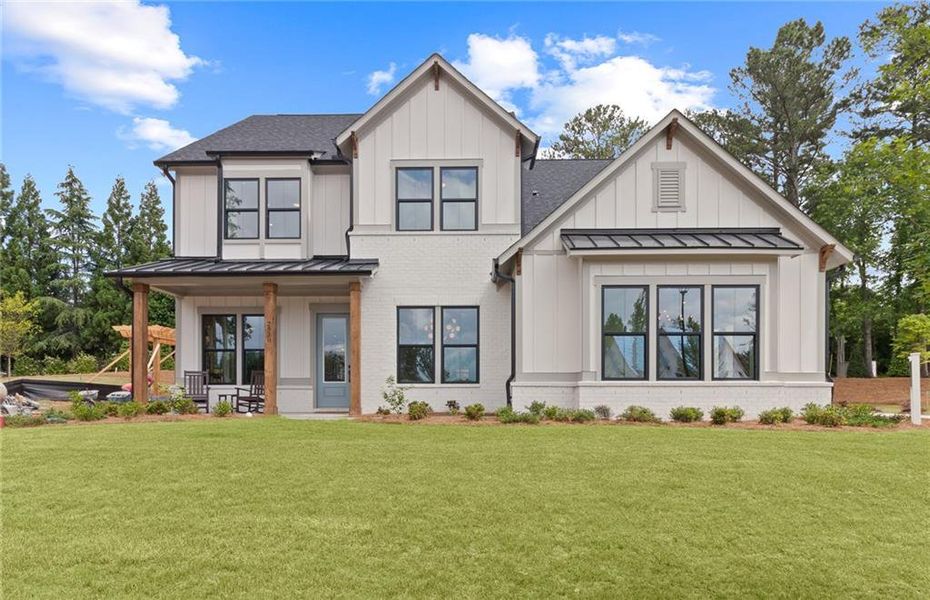 Front exterior of a new home in Sterling Pointe, Cumming, GA, highlighting curb appeal (Image 1). Front exterior of a new home in Sterling Pointe, Cumming, GA, highlighting curb appeal (Image 1).