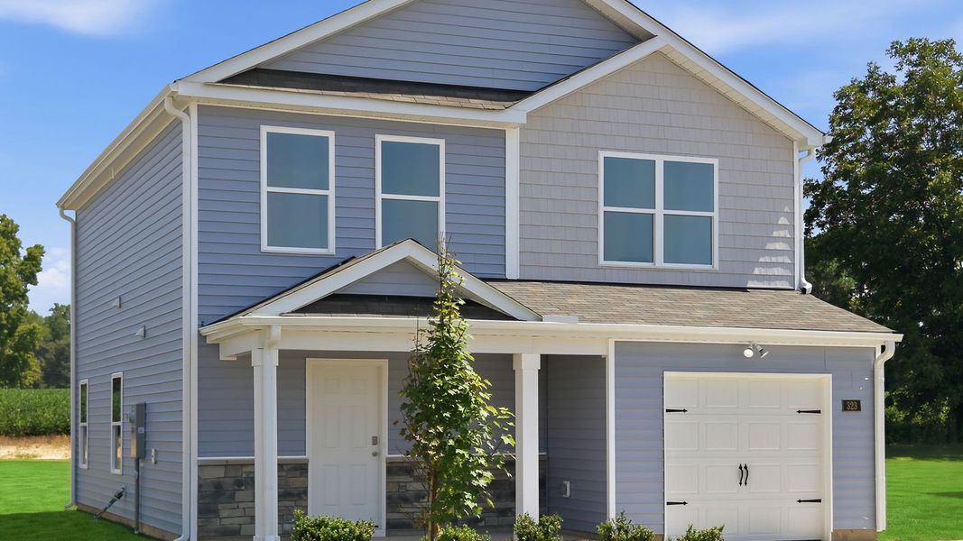 Front exterior of a new home in Hobbs Farm, Ayden, NC, highlighting curb appeal (Image 21).