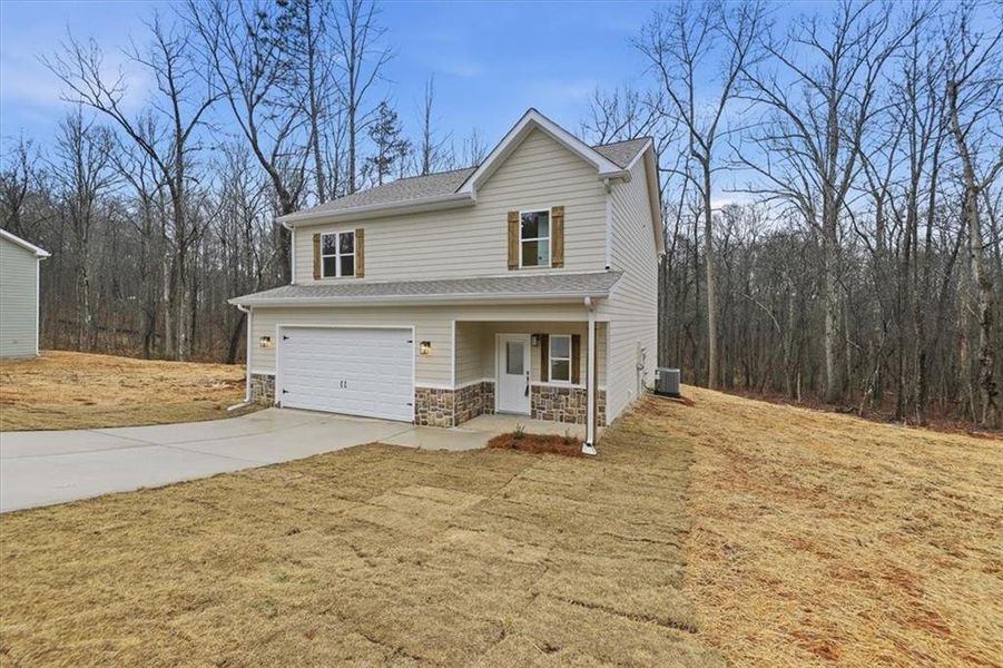 Front exterior of a new home in , Carrollton, GA, highlighting curb appeal (Image 25).