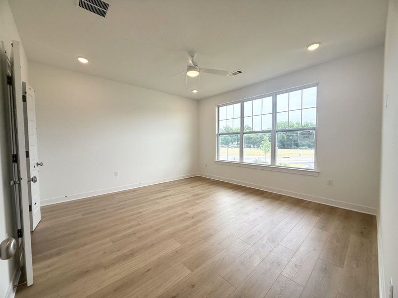 Spare room featuring ceiling fan, light wood-style floors, baseboards, and recessed lighting Spare room featuring ceiling fan, light wood-style floors, baseboards, and recessed lighting