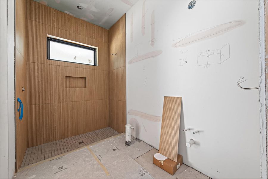 Ensuite bath for the fifth bedroom with access to the patio could also be used as a pool shower