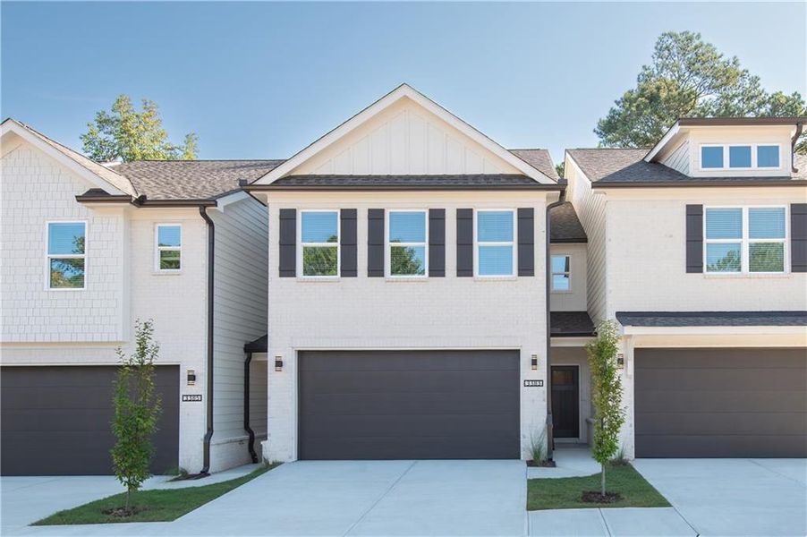 Front exterior of a new home in , Snellville, GA, highlighting curb appeal (Image 1).