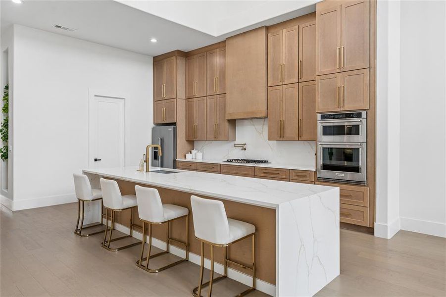 Beautiful shaker style cabinets, quartz countertops and island waterfall Beautiful shaker style cabinets, quartz countertops and island waterfall