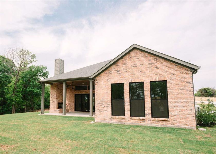 Front exterior of a new home in , Weatherford, TX, highlighting curb appeal (Image 20).