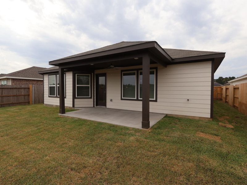 Front exterior of a new home in Pinewood at Grand Texas, New Caney, TX, highlighting curb appeal (Image 11). Front exterior of a new home in Pinewood at Grand Texas, New Caney, TX, highlighting curb appeal (Image 11).
