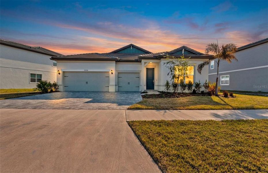Front exterior of a new home in Two Rivers, Zephyrhills, FL, highlighting curb appeal (Image 17).