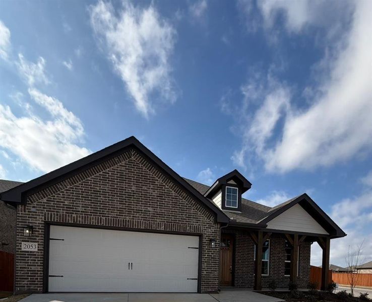 View of front of house featuring a garage, brick siding, concrete driveway, a porch, and roof with shingles View of front of house featuring a garage, brick siding, concrete driveway, a porch, and roof with shingles