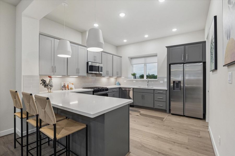 elegantly designed U shaped kitchen - Photo is of model at 6340, finishes are similar. elegantly designed U shaped kitchen - Photo is of model at 6340, finishes are similar.