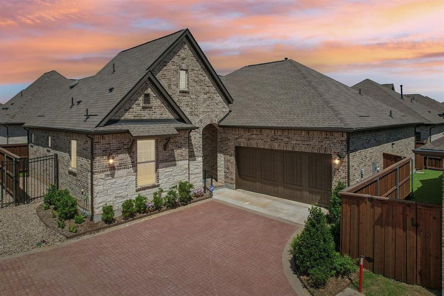 Front exterior of a new home in Elements at Viridian - Garden Series, Arlington, TX, highlighting curb appeal (Image 1). Front exterior of a new home in Elements at Viridian - Garden Series, Arlington, TX, highlighting curb appeal (Image 1).