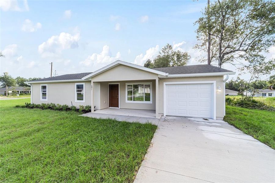 Front exterior of a new home in , Dunnellon, FL, highlighting curb appeal (Image 19). Front exterior of a new home in , Dunnellon, FL, highlighting curb appeal (Image 19).