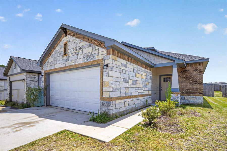 Front exterior of a new home in , Montgomery, TX, highlighting curb appeal (Image 22).