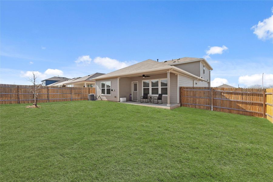Your private outdoor oasis awaits! This massive, lush backyard is fully enclosed by a privacy fence and features a covered patio, making it the perfect spot for weekend BBQs or quiet morning coffee.