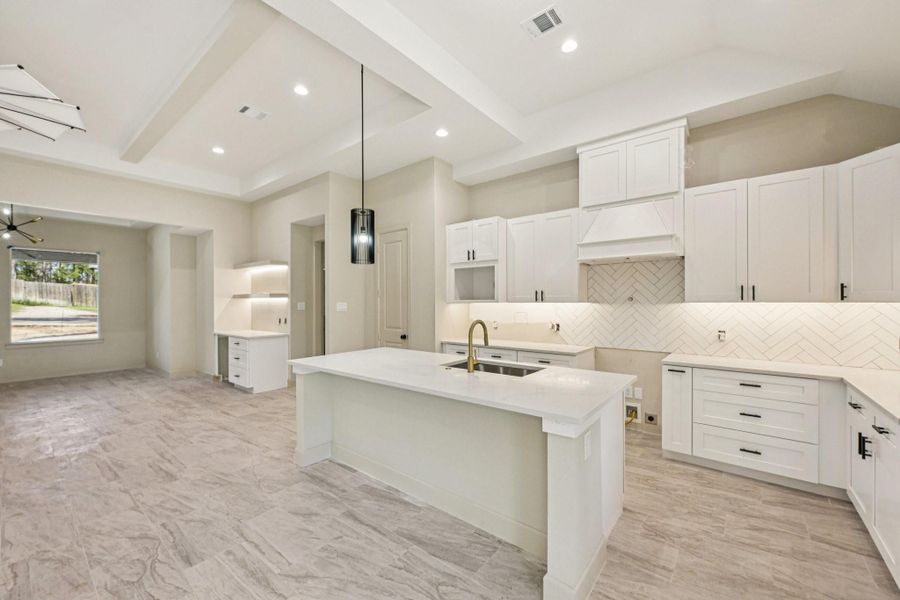 An additional view of the beautiful kitchen, showcasing its stylish finishes and open layout.