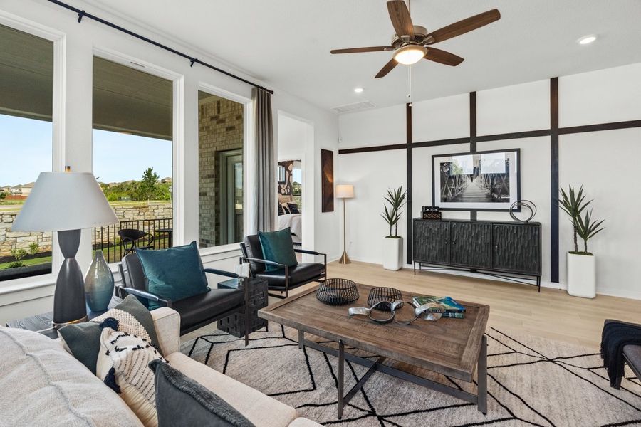 Representative furnished interior of a home built from the Peyton by Chesmar Homes in University Heights, Round Rock (Image 6).