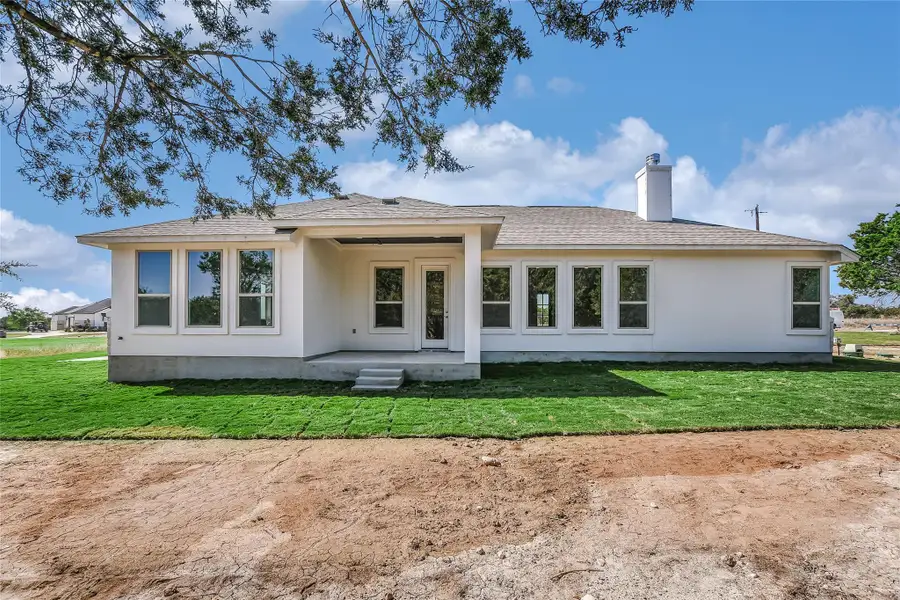 Front exterior of a new home in , Burnet, TX, highlighting curb appeal (Image 14).