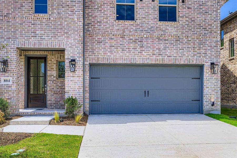 Garage featuring driveway
