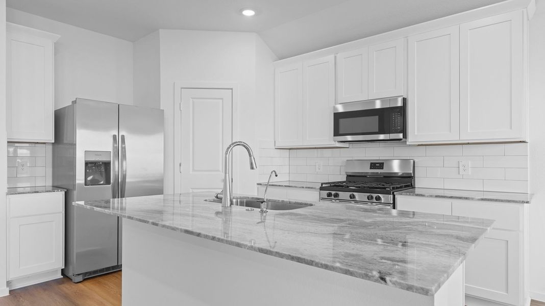 Furnished interior view inside a new home in Caldwell Crossing, Iowa Colony (Image 3). Furnished interior view inside a new home in Caldwell Crossing, Iowa Colony (Image 3).