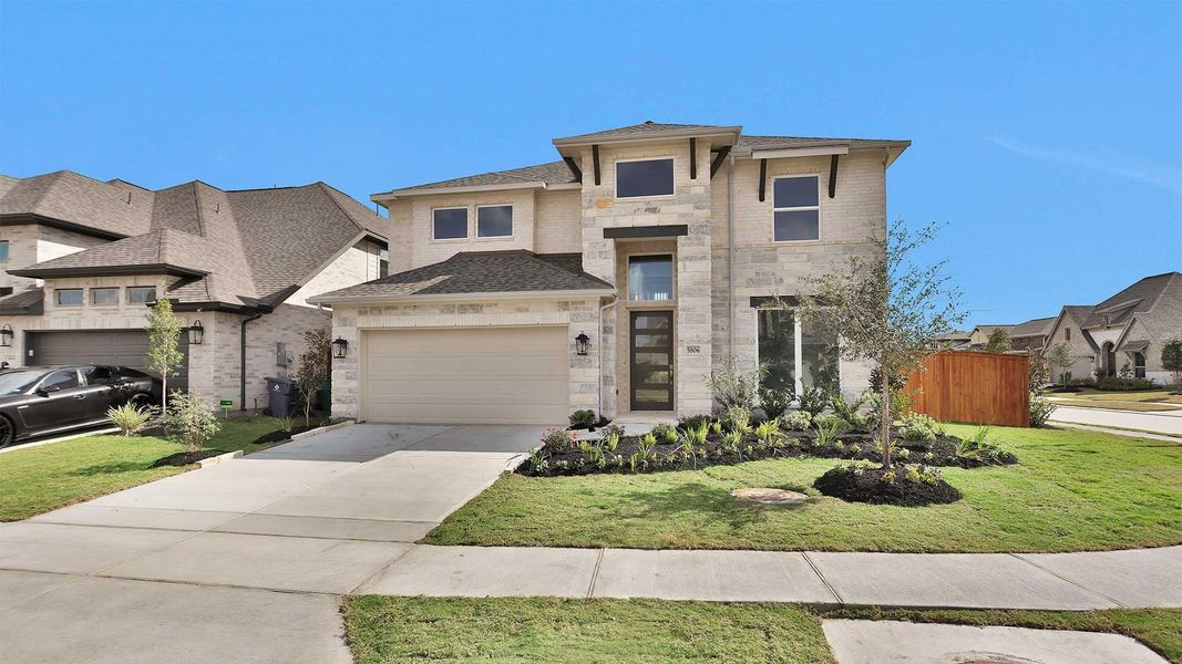 Front exterior of a new home in Meridiana 55', Manvel, TX, highlighting curb appeal (Image 1). Front exterior of a new home in Meridiana 55', Manvel, TX, highlighting curb appeal (Image 1).