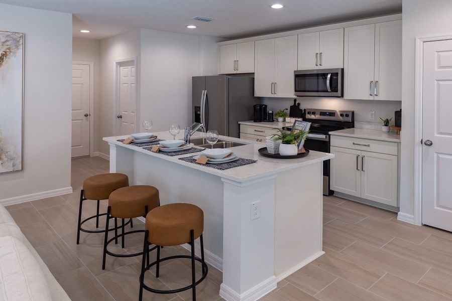 Furnished interior view inside a new home in Blue Springs Reserve Townhomes, Groveland (Image 5).