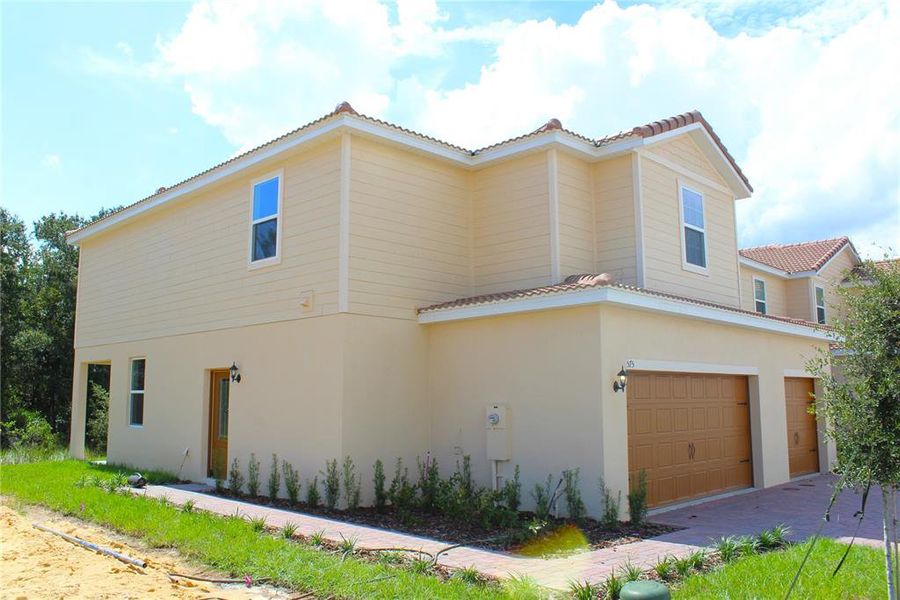 Exterior details and patio area of a home in Noah Estates at Tuscany Preserve, Poinciana (Image 2).